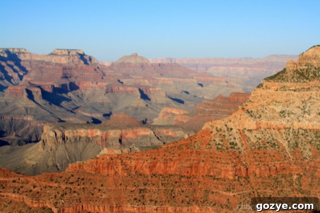 IMG_3596 A wide shot of the Grand Canyon, capturing the immense horizon and intricate details.