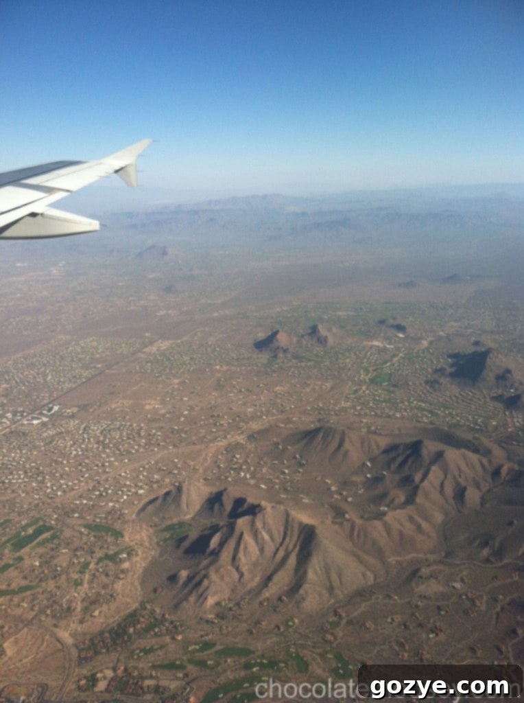 IMG_1490 Sweeping view of mountain ranges, highlighting the vastness of the natural landscape from above.
