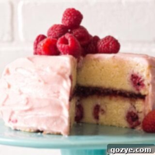 Lemon raspberry cake on turquoise cake stand