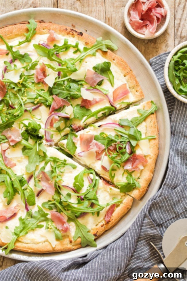 Prosciutto and Arugula Pizza 5 Slice cut out of prosciutto arugula pizza