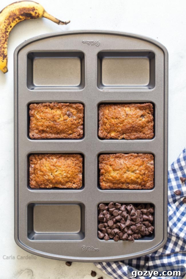 Petite Banana Bread Delights 4 Banana bread baking in an 8-cavity mini loaf pan, showcasing multiple small loaves