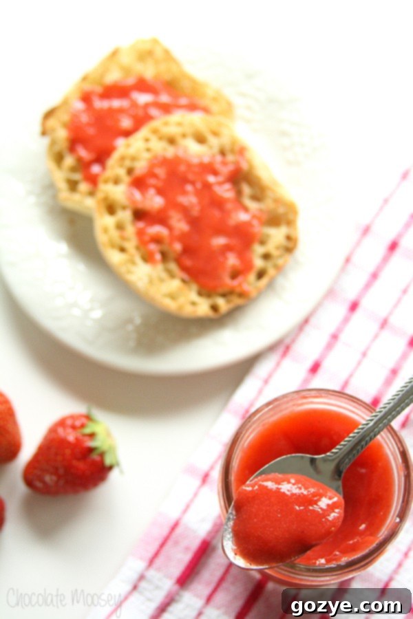 Vegan strawberry curd spread generously on English muffins for breakfast.