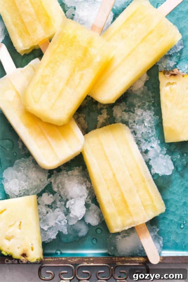 Pineapple popsicles on a teal tray