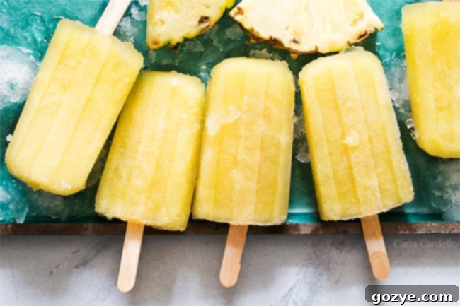 Pineapple popsicles on a teal tray