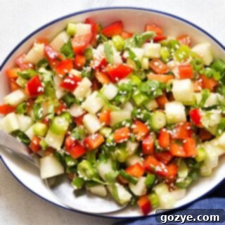 White bowl filled with green onion salad, ready to be served