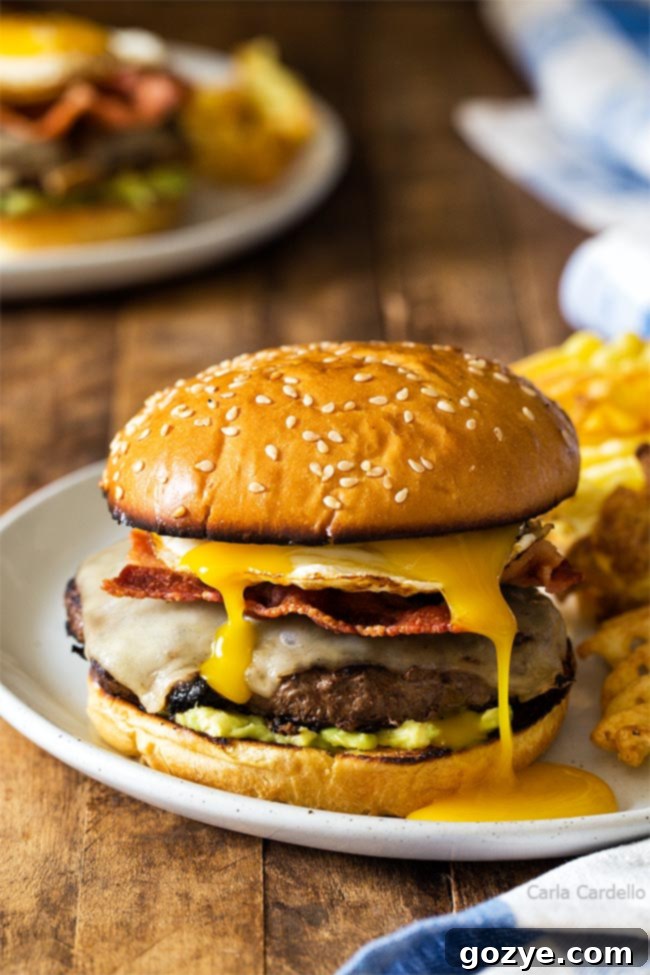 Golden Yolk Burger 2 Runny egg on Breakfast Burger, showcasing the golden yolk dripping down the patty and bacon