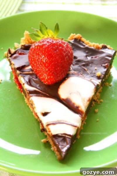 Strawberry S'mores Tart being prepared, showing the chocolate ganache layer