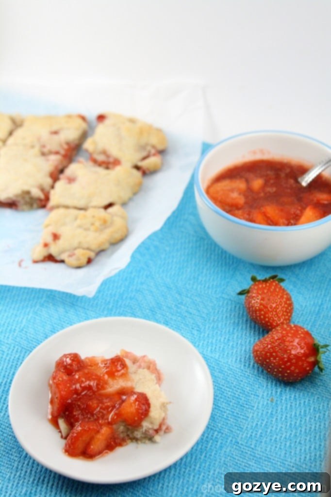 A rustic stack of freshly baked Strawberry Cream Biscuits, ready to be pulled apart