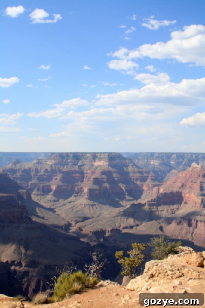 A majestic view of the Grand Canyon under a dramatic sky, perhaps hinting at sunset.