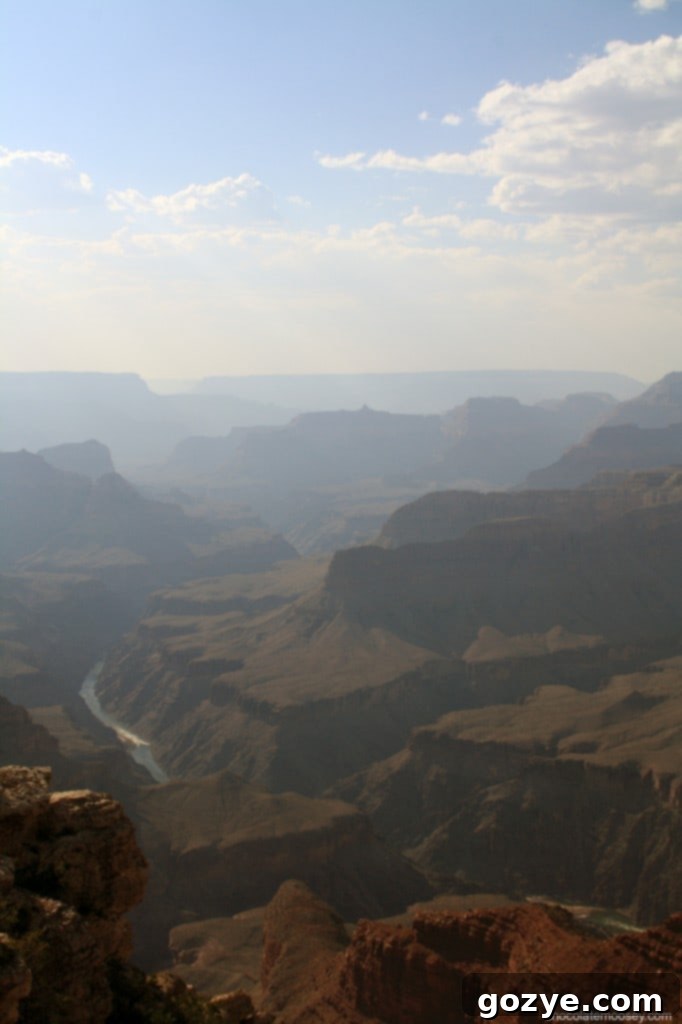 A striking vertical image showing the Colorado River winding through the Grand Canyon.