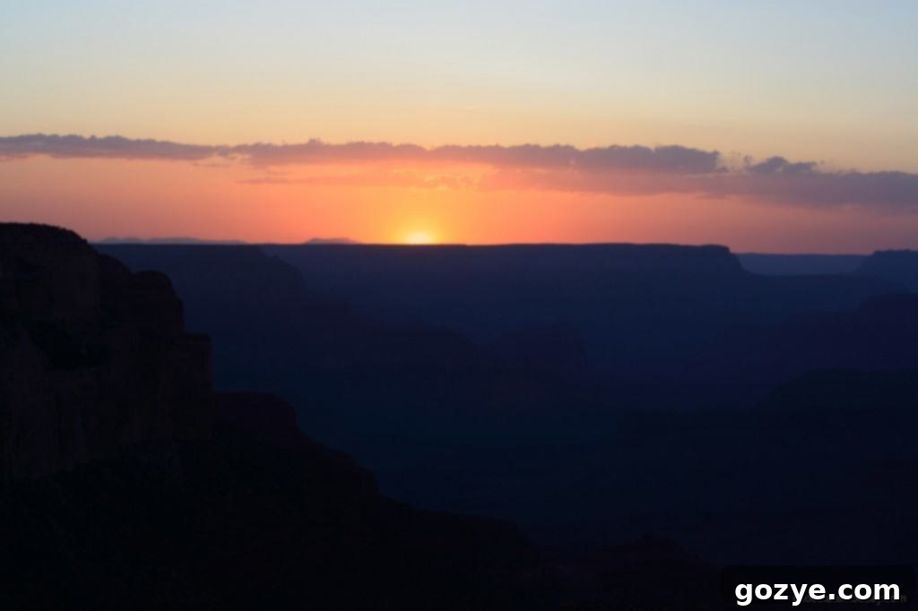 A breathtaking wide shot of the Grand Canyon at golden hour, with warm light.