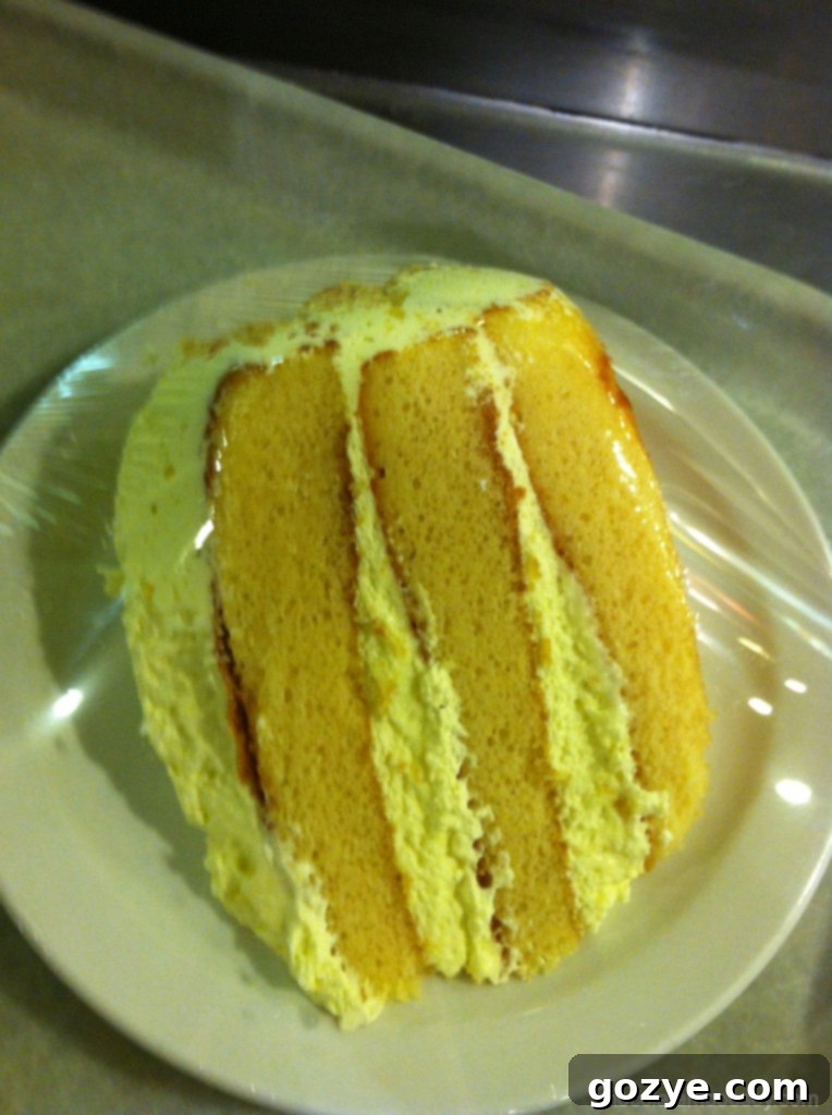 A slice of delicious Lemon Layer Cake, a perfect birthday treat.
