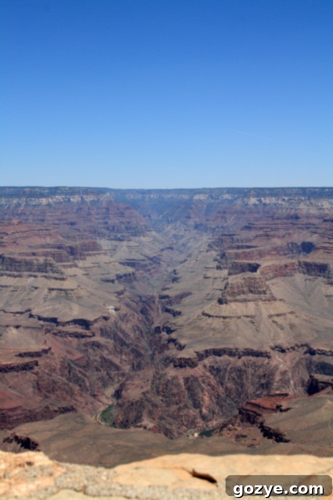 Vertical shot capturing the immense depth and layered geology of the Grand Canyon.