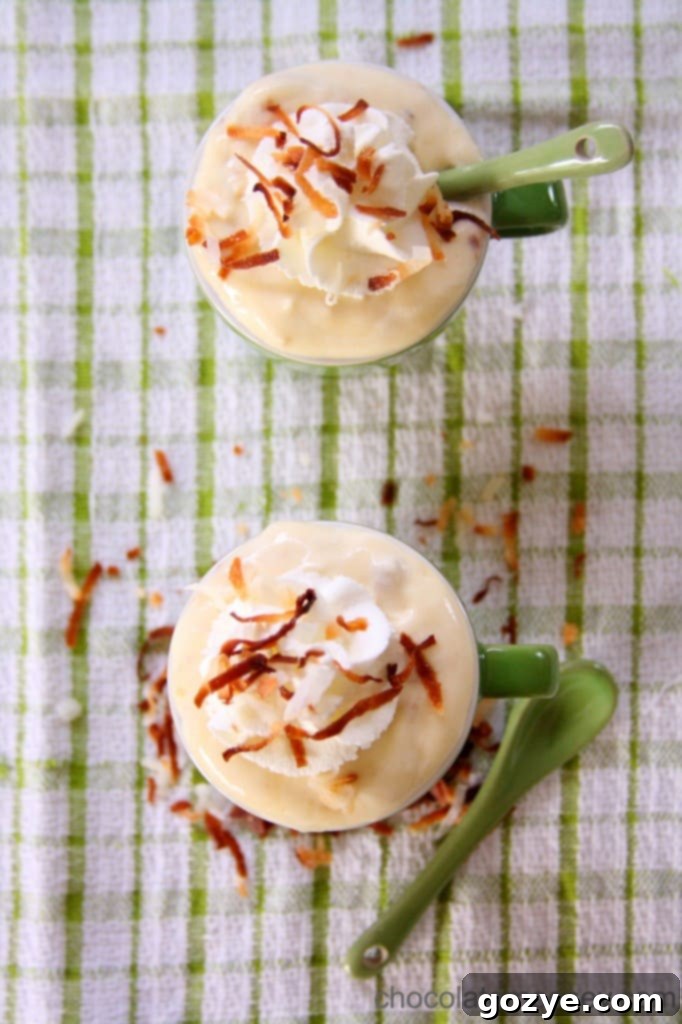 Coconut Cream Pudding in a small glass, ready to be garnished