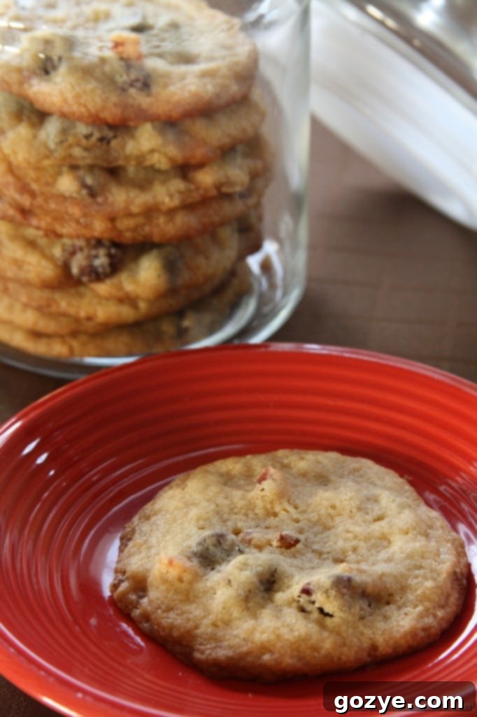 A final shot of a plate of Bacon and Dried Cherry Chocolate Chip Cookies, ready to be enjoyed