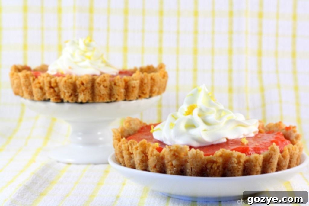 Golden Oreo Cherry Curd Tartlettes arranged on a cooling rack, ready to be enjoyed.