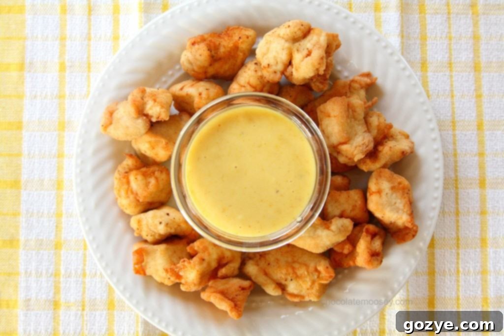 Close-up of golden brown, perfectly fried Chick-Fil-A style chicken nuggets