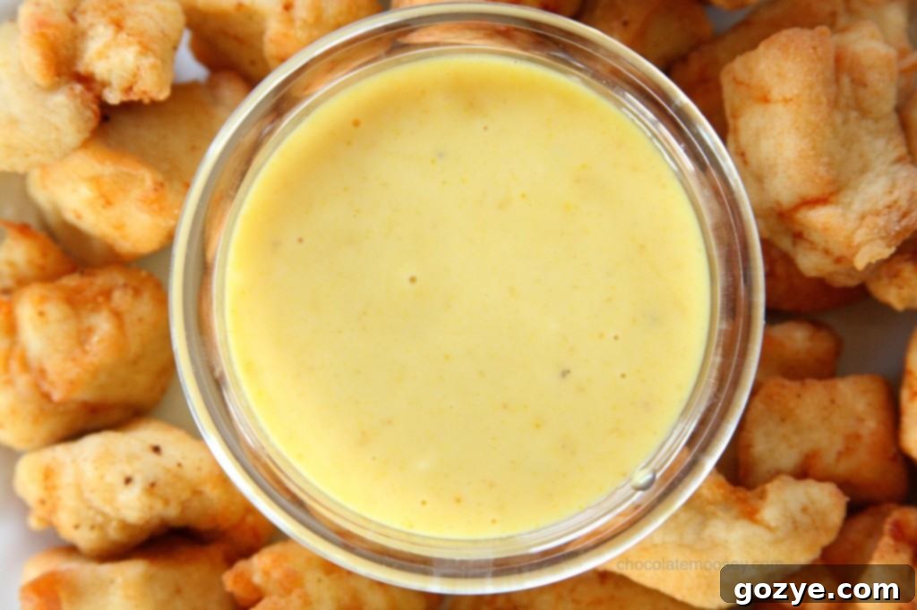 Deep frying bite-sized chicken pieces for Chick-Fil-A style nuggets in hot oil