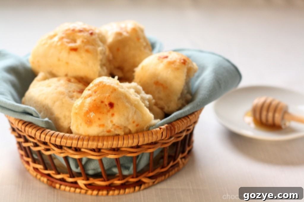 Beautifully composed close-up of Honey Butter Dinner Rolls, showcasing good lighting and detail