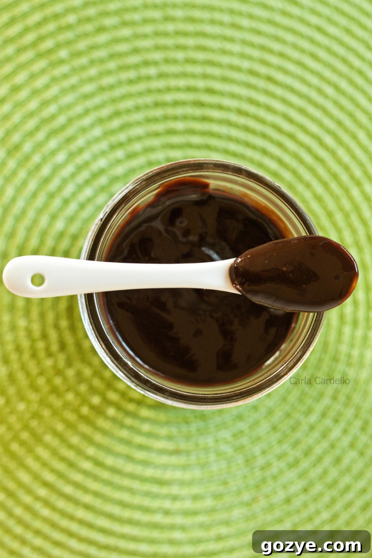 Spoon on top of spoon with Nutella sauce, rich and glossy