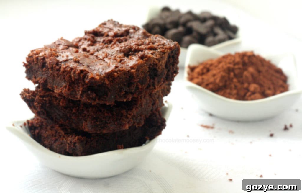 Rich, fudgy raspberry cocoa brownies in a pan, ready to be sliced