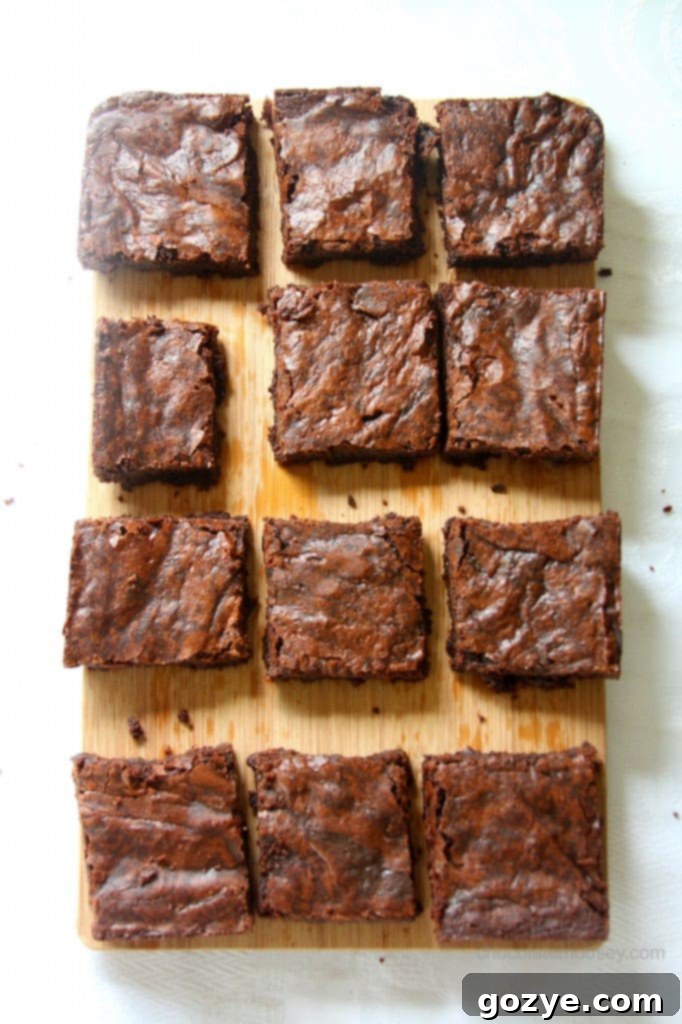 Close-up of a warm, sliced one-pot raspberry cocoa brownie, showcasing its fudgy interior