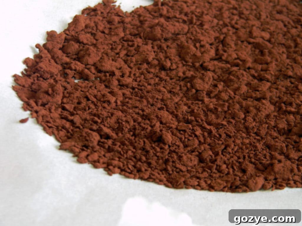 Homemade raspberry cocoa powder mixture drying on parchment paper