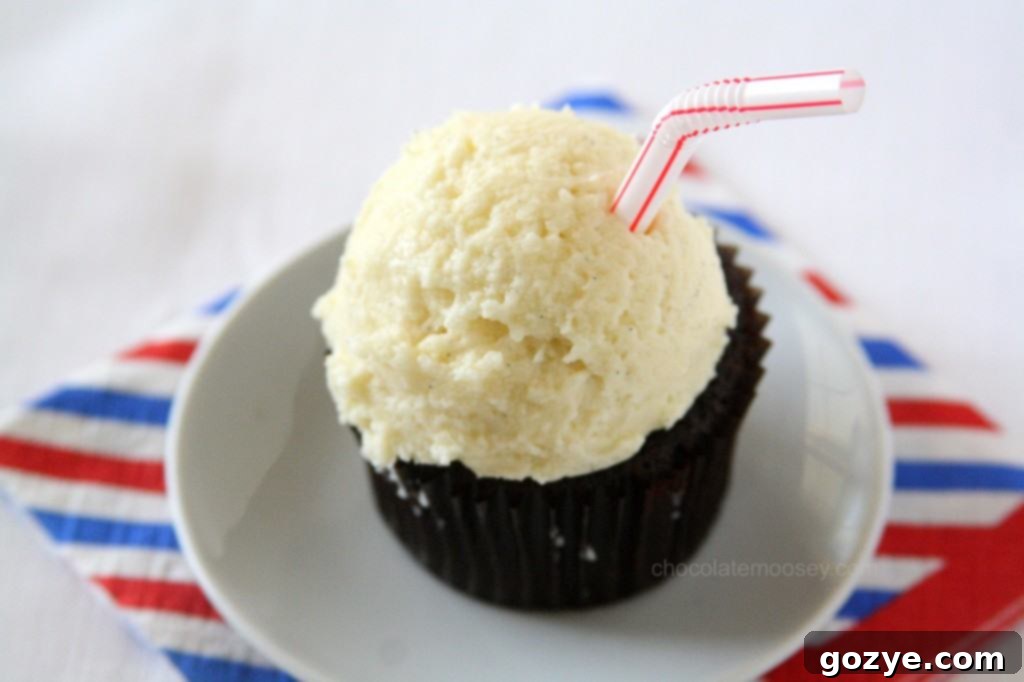 Root Beer Float Cupcakes generously topped with vanilla frosting and mini straws