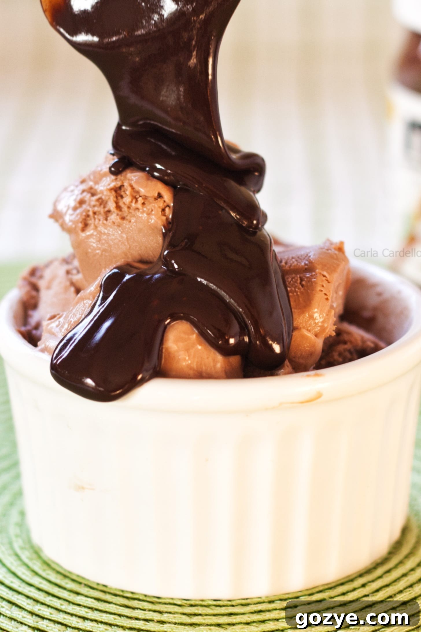 Pouring hot fudge sauce over Nutella Ice Cream