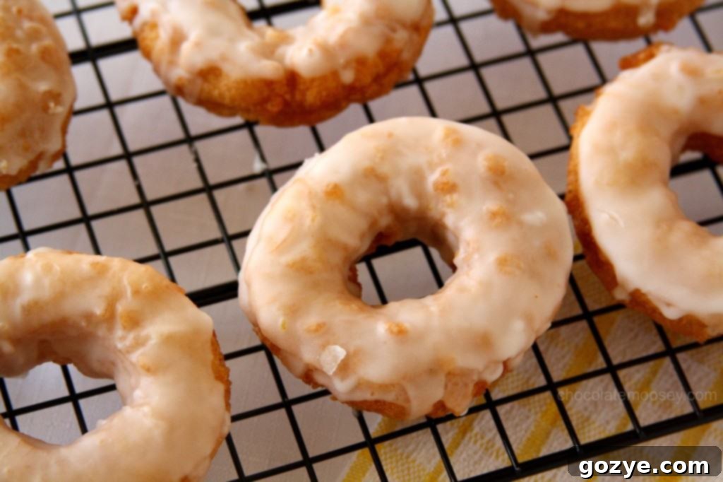 Double Lemon Glazed Doughnuts from www.chocolatemoosey.com Close-up of freshly fried Double Lemon Glazed Doughnuts