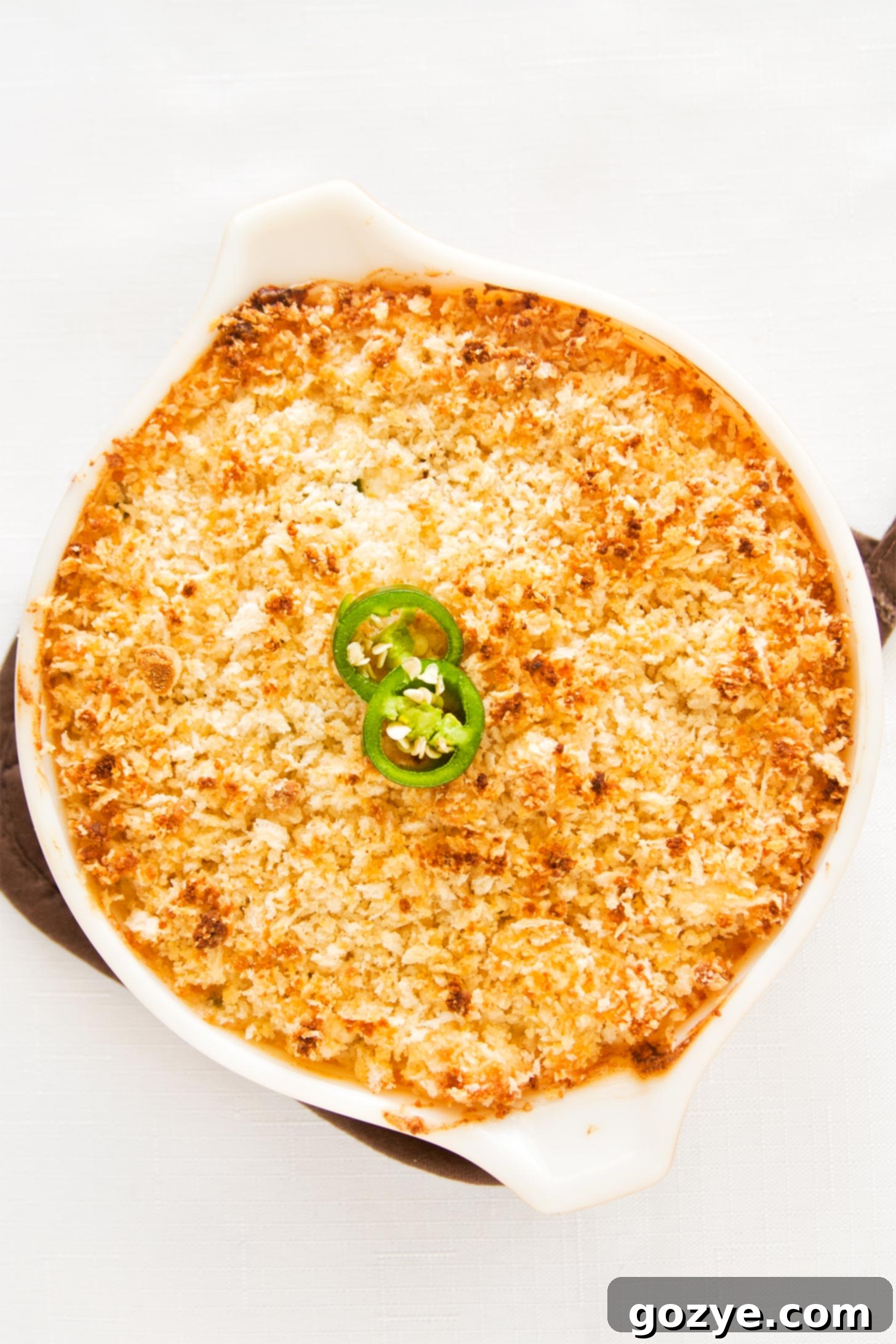 Jalapeno popper dip in casserole dish, ready to be served.