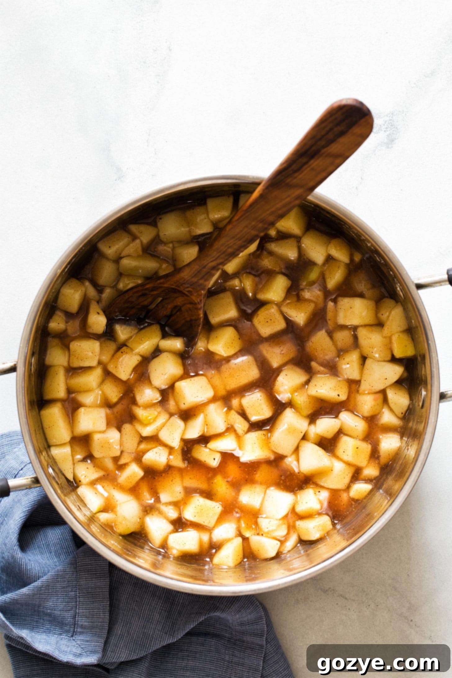 Cooked apple pie filling in a large pot