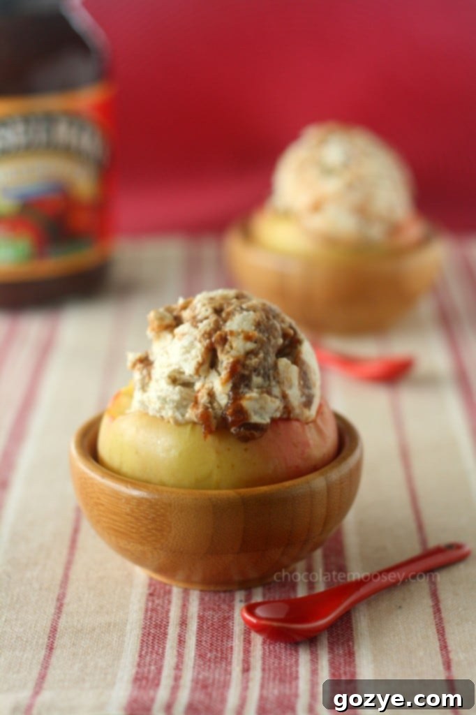 Side view of Apple Butter Cheesecake Ice Cream in a halved apple bowl