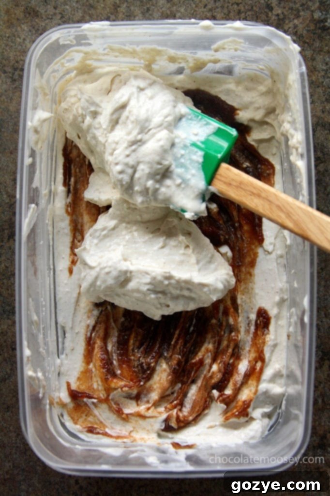 Two servings of Apple Butter Cheesecake Ice Cream in apple bowls
