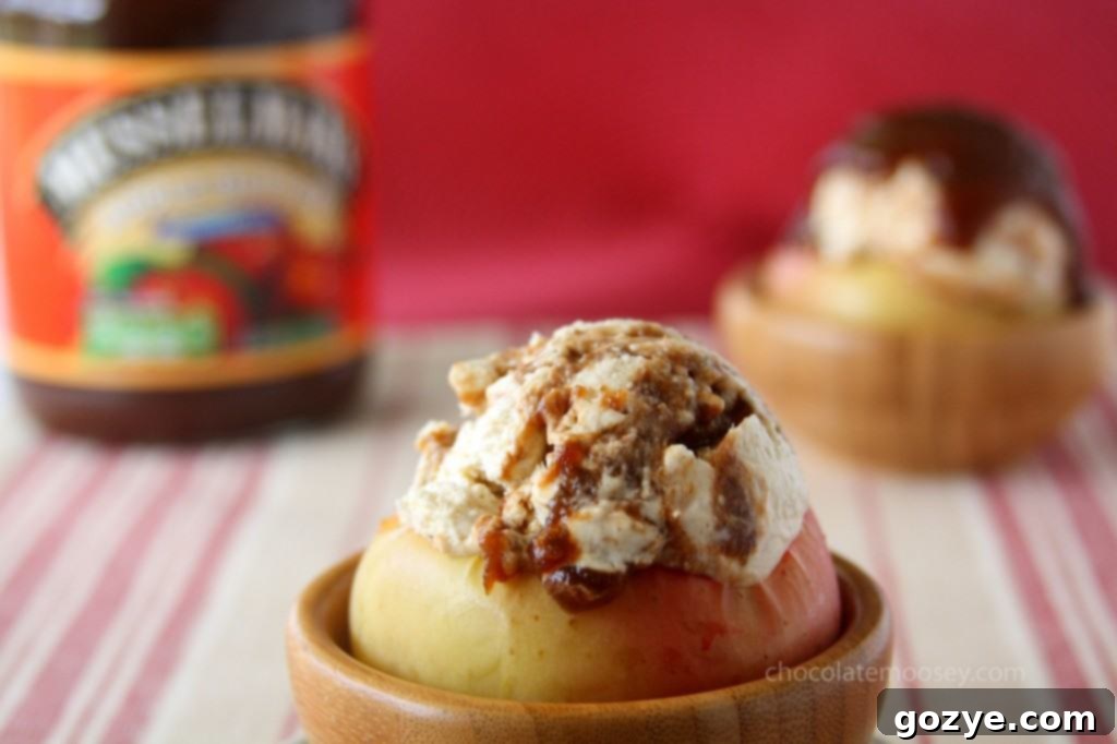 Two servings of Apple Butter Cheesecake Ice Cream in apple bowls from another angle