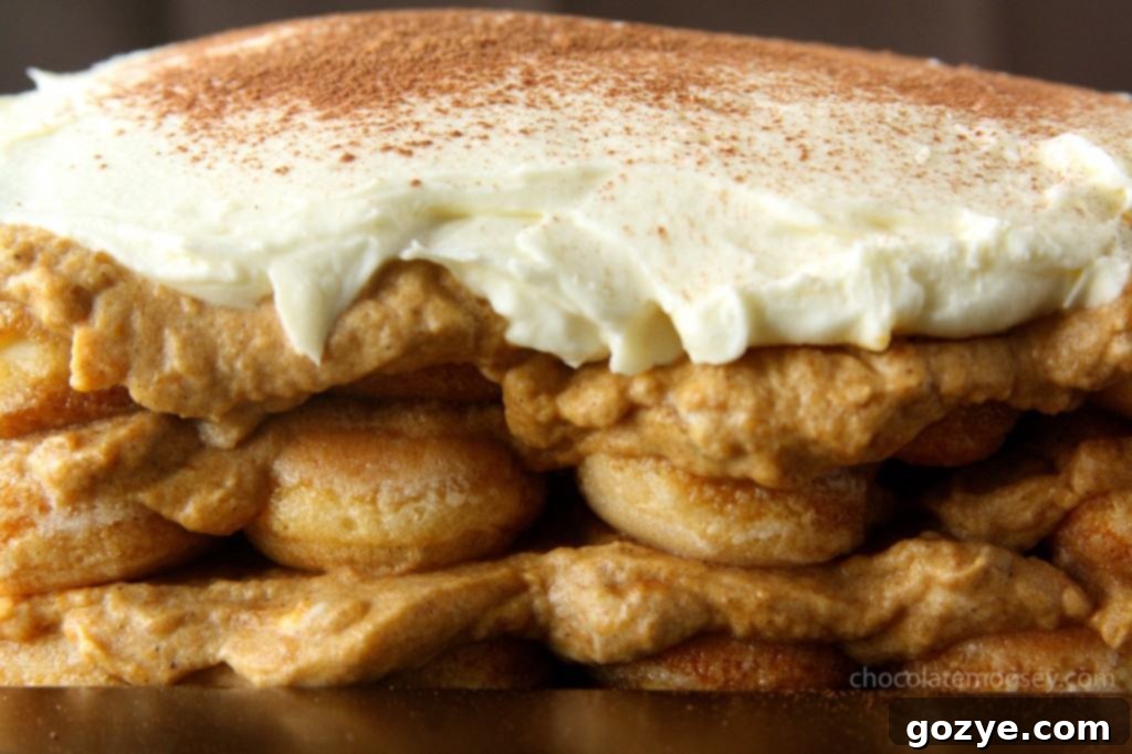 Pumpkin Tiramisu with a creamy mascarpone topping, ready for dusting with cocoa powder.