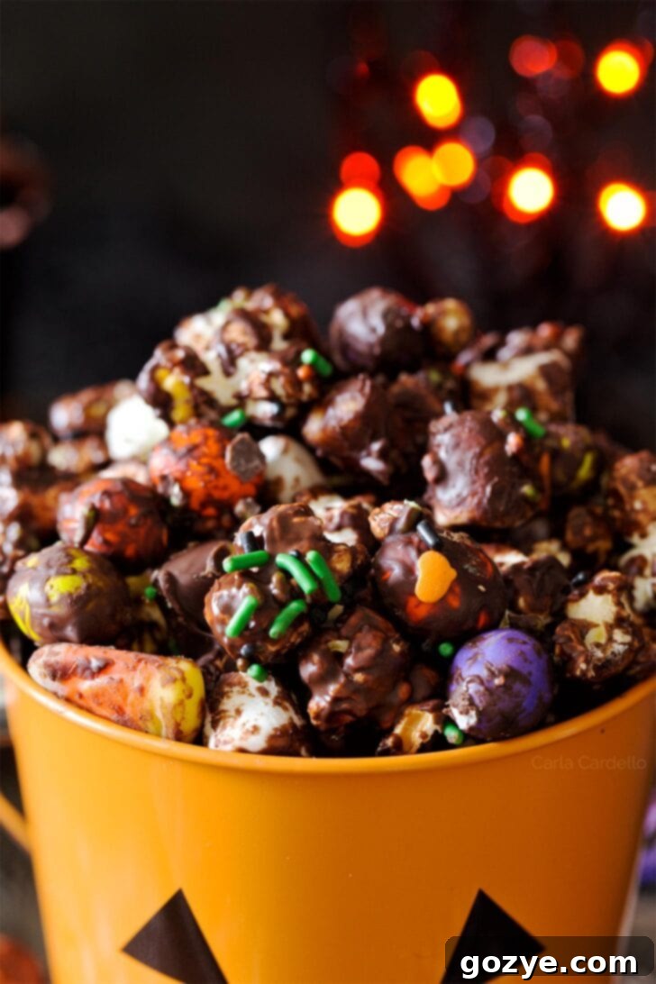 Close up of Halloween popcorn mix in orange bucket