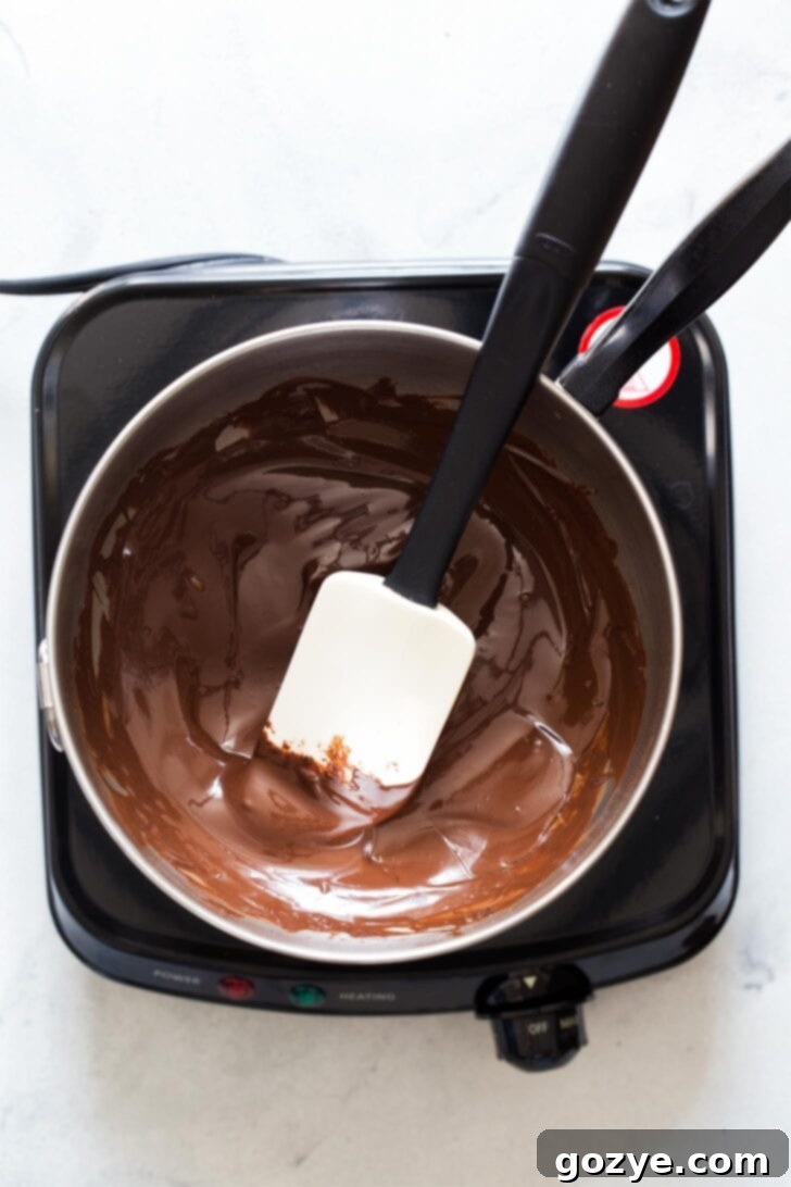 Melting chocolate to make Halloween popcorn