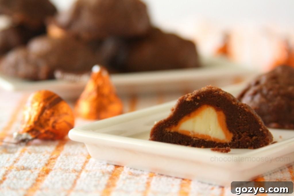 Stuffed Pumpkin Spice Kiss Cookies, showcasing the rich chocolate dough