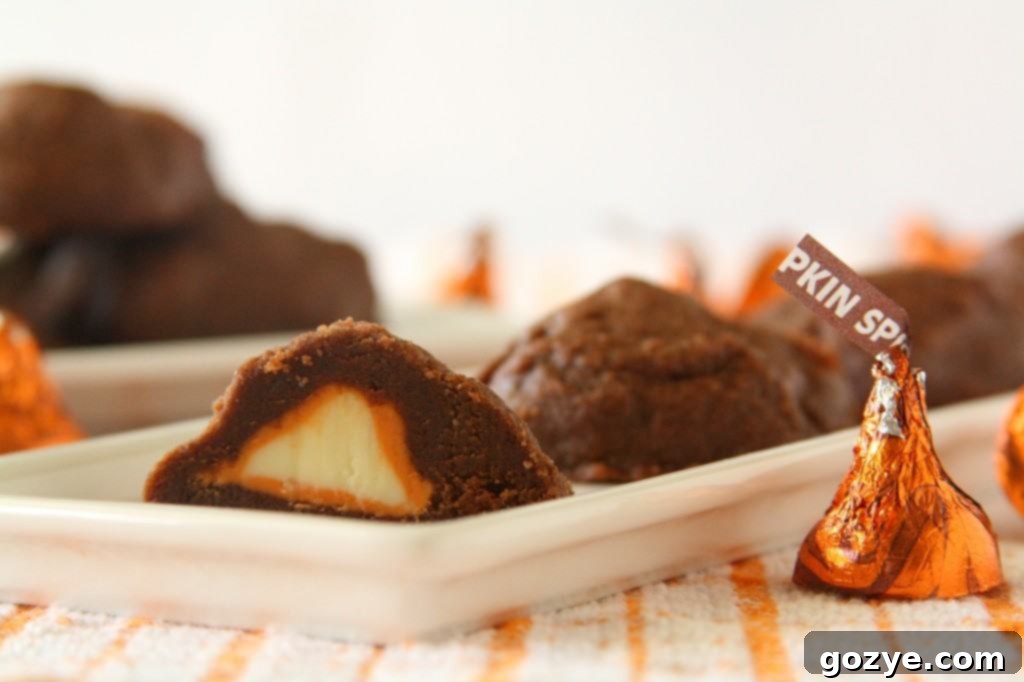 Stuffed Pumpkin Spice Kiss Cookies, with a peek at the delicious interior