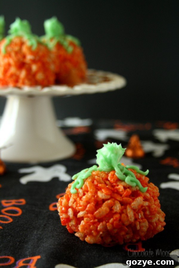 Rice Krispie Pumpkins on black Halloween fabric
