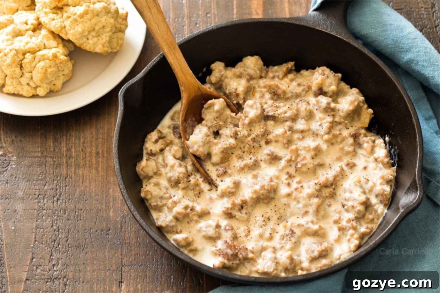 Sausage gravy cooked in cast iron skillet, ready to be served