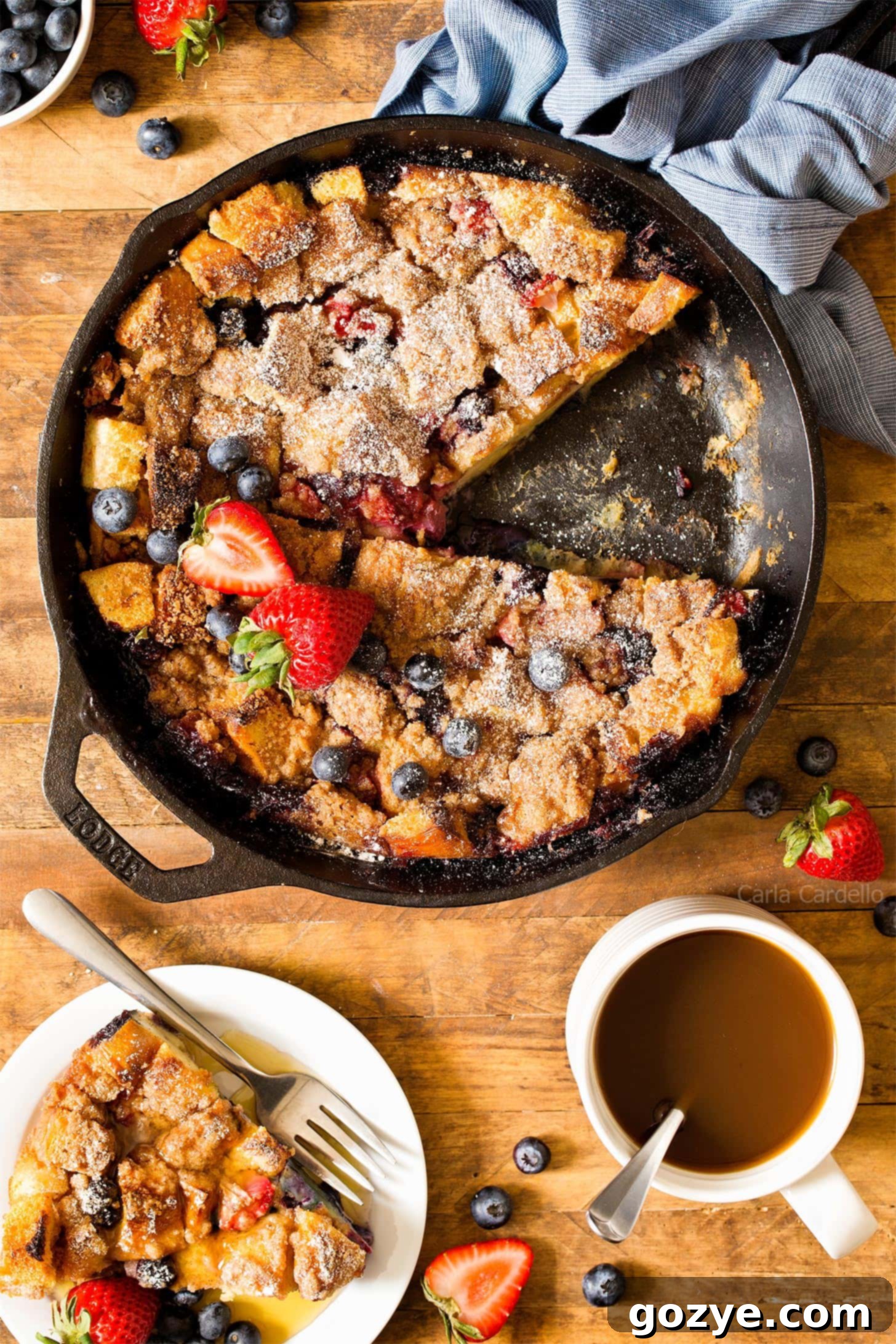 Cozy French Toast Casserole for Two 4 A slice cut from a golden brown overnight French toast casserole, showing the custardy interior with berries