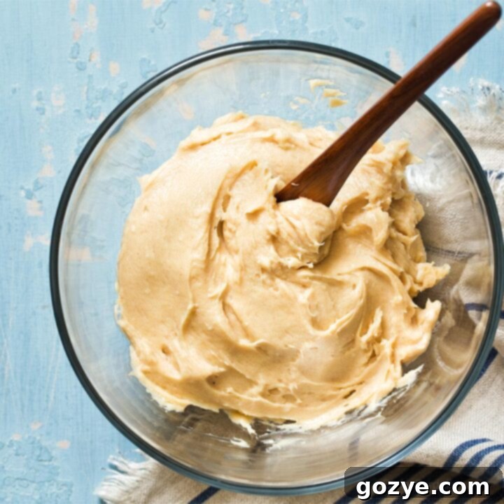 Glass bowl with cream cheese peanut butter frosting