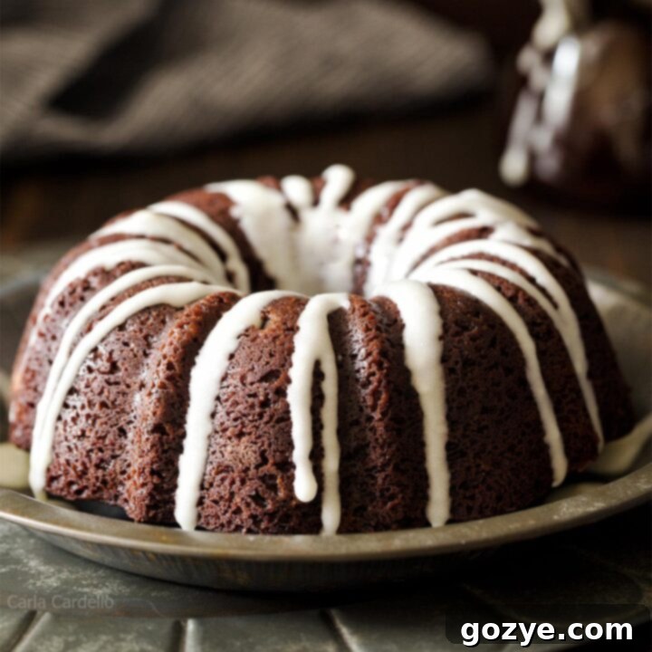 Small Glazed Chocolate Bundt Cake on a plate, ready to be served