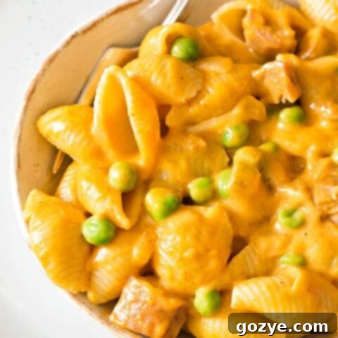 Close up of pumpkin mac and cheese, showing its vibrant color and hearty ingredients.