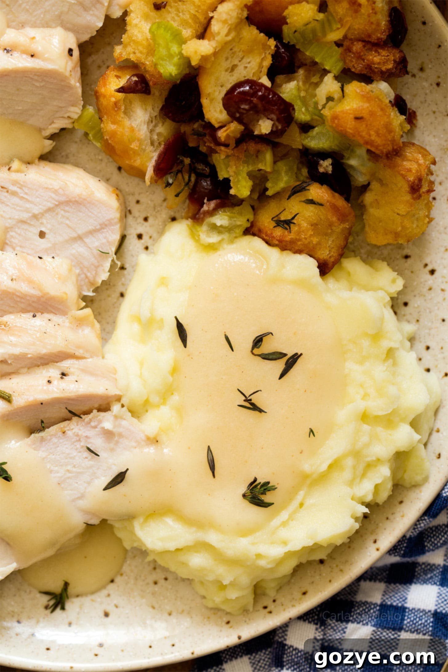 Homemade Turkey Gravy from Pan Drippings 3 Turkey gravy on top of mashed potatoes