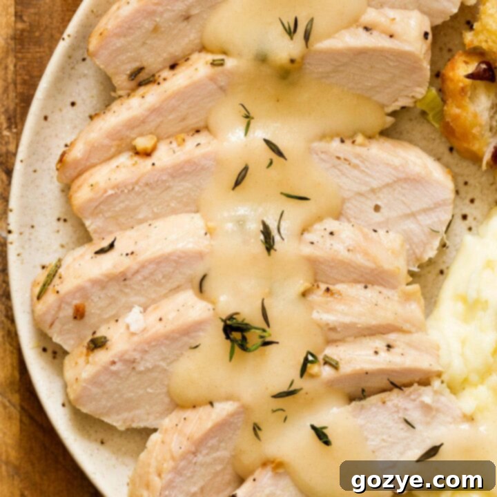 Sliced turkey breast with homemade turkey gravy on top