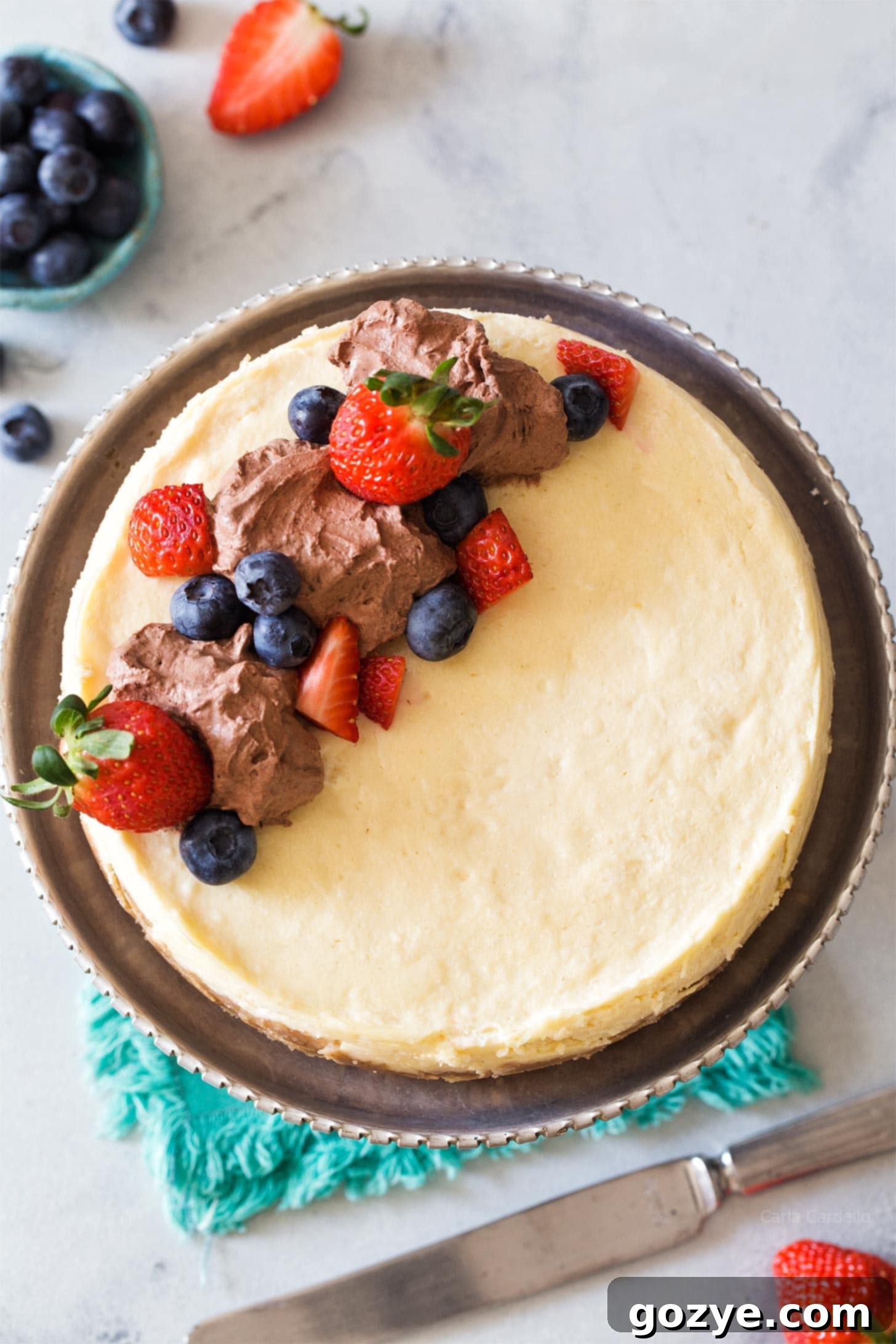 Overhead shot of Instant Pot Cheesecake topped with fresh berries.