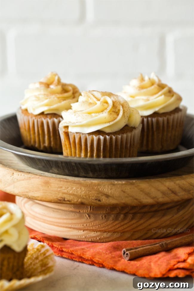 Mini Pumpkin Pie Delights 29 Pumpkin Cupcakes on a cake stand, beautifully arranged for a festive display.